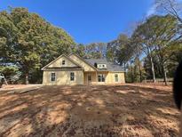 Newly constructed craftsman style home with light yellow siding and a gray roof at 569 Winndale Rd, Dallas, GA 30157