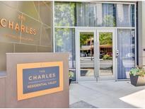Modern building entrance with valet service at The Charles in Buckhead Village, Atlanta at 3107 Peachtree Ne Rd # 1101, Atlanta, GA 30305