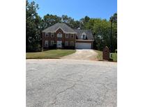 Two story brick home with attached garage at 6209 Southland Forest Dr, Stone Mountain, GA 30087