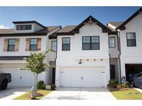 Modern two-story townhome with white exterior at 51 S Auburn Landing Pl # 51, Auburn, GA 30011
