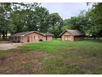 Property with house, detached garage, and large yard at 3061 Sandy Plains Rd, Marietta, GA 30066