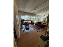 Spacious living room with hardwood floors and large windows at 563 Se Memorial Se Dr # 401, Atlanta, GA 30312