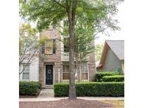 Brick front of townhome with landscaping at 9931 Mancunian Way, Douglasville, GA 30135