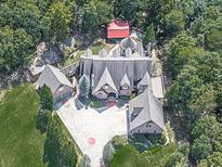 Luxury home with large yard and multiple outbuildings at 404 Folsom Glade Rd, Rydal, GA 30171