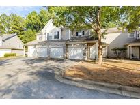 Two-story townhome with three-car garage and landscaping at 46 Bay Branch Blvd, Fayetteville, GA 30214