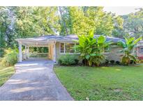 Ranch house with covered porch and landscaped yard at 2812 Mitchell Dr, Decatur, GA 30032