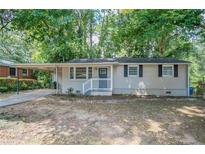 Cute ranch home with covered carport and small front yard at 416 Macedonia Se Rd, Atlanta, GA 30354