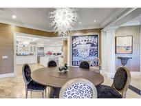 Elegant dining room with large round table and statement art at 3286 Northside Nw Pkwy # 1005, Atlanta, GA 30327