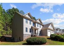 Two-story house with stone accents and landscaping at 906 Fox Croft Pl, Canton, GA 30114