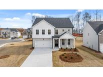 Two-story house with gray siding and landscaping at 1931 Lacebark Elm Way, Lawrenceville, GA 30045