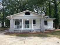 Charming bungalow with front porch and stone columns at 916 Cascade Sw Rd, Atlanta, GA 30311