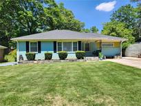 Ranch style home with a freshly painted exterior and well-maintained lawn at 3242 Bonway Dr, Decatur, GA 30032