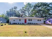 Newly renovated light gray house with red door at 1669 Freedom Vly, Decatur, GA 30032