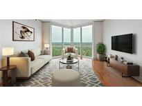 Bright living room with hardwood floors, city views, and modern furniture at 2870 Pharr Court South Nw # 2407, Atlanta, GA 30305