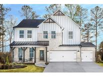 Farmhouse style home with two-car garage at 7635 Homer Dr, Cumming, GA 30028