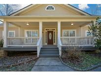 Inviting ranch home with a large front porch and three-car garage at 6865 Cowan Mill Rd, Winston, GA 30187