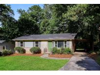 Brick ranch house with a green door and carport at 3523 Se Garfield Se Way, Atlanta, GA 30354