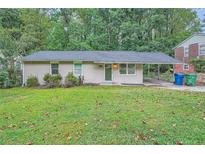 Charming ranch home with carport and lawn at 700 Symphony Nw Ln, Atlanta, GA 30318