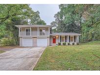 Two-story house with attached two-car garage at 1123 Redan Way, Stone Mountain, GA 30088