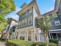 Three-story building with blue siding and stone accents at 1575 Ridenour Nw Pkwy # 804, Kennesaw, GA 30152