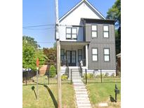 Modern two-story house with gray siding and black accents at 727 Cascade Sw Ave, Atlanta, GA 30310