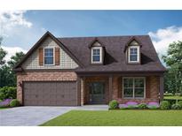 Brick home with two-car garage and landscaping at 3627 Lockaby Way, Lawrenceville, GA 30044