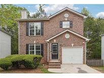 Brick two-story house with a two-car garage at 4029 Riverside Pkwy, Decatur, GA 30034