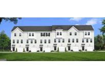 Exterior view of three-story townhomes with attached garages at 3136 Washburn St, Atlanta, GA 30354