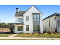 Stunning two-story home with modern farmhouse exterior at 6051 Stallion Rdg, Douglasville, GA 30135