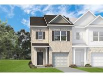 Two-story townhome with a brick facade and a two-car garage at 260 Dupont Dr # 71, Cartersville, GA 30121