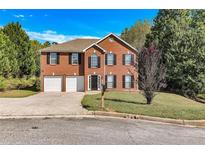 Two story brick home with attached garage at 2146 Silva Ct, Conley, GA 30288