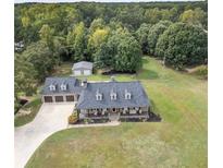 Ranch home with 3 car garage, large yard, and detached workshop at 1150 Youth Jersey Rd, Loganville, GA 30052