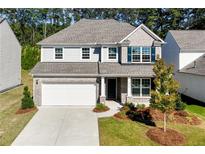 Two story home with gray siding and brick accents at 6019 Wheeler Ridge Rd, Auburn, GA 30011