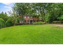 Brick home with lush green lawn and driveway at 1323 Briarcliff Ne Rd, Atlanta, GA 30306