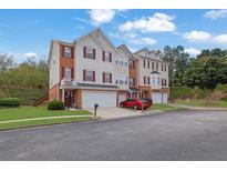 Three story townhome with two-car garage at 5989 Turfway Park Ct, Sugar Hill, GA 30518