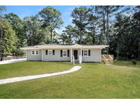 Newly renovated home with a charming front yard and walkway at 2656 County Line Sw Rd, Atlanta, GA 30331