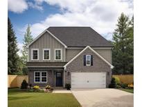 Two story house with gray siding and a brick front at 3301 Pepperpike Ct, Loganville, GA 30052