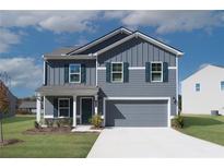 Two-story house with gray siding and a two-car garage at 3290 Forest Green Dr, Douglasville, GA 30135