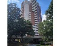 Brick high-rise building with balconies and ample parking at 375 Ralph Mcgill Blvd # 505, Atlanta, GA 30312
