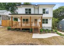 Modern farmhouse exterior with front porch and landscaping at 1962 Compton Se Dr, Atlanta, GA 30315
