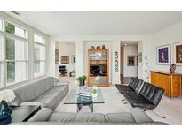 Bright living room with comfortable seating and city views at 2500 Peachtree Nw Rd # 405S, Atlanta, GA 30305