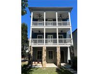 Three-story home with stone base and wrap-around porch at 956 Glenwood Park Se Dr, Atlanta, GA 30316