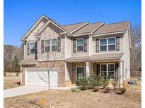 Two-story house with brick and siding exterior at 188 Sophie Cir, Locust Grove, GA 30248