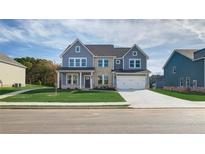 Two-story house with gray siding, stone accents, and a three-car garage at 204 Blanton Ln, Stockbridge, GA 30281