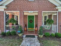 Brick house with green door and porch at 133 Hillside Se Ave, Atlanta, GA 30315