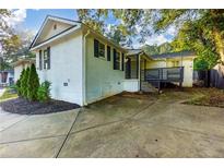 Home features a deck and a spacious backyard at 2911 Glenwood Se Ave, Atlanta, GA 30317
