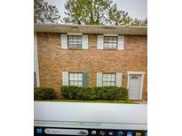 Brick townhouse exterior with landscaping at 6354 Shannon Pkwy # 12F, Union City, GA 30291