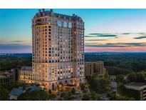 Aerial view of a luxury high rise building at sunset at 88 W Paces Ferry Nw Rd # 1130, Atlanta, GA 30305