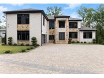 Luxury two-story home with stone accents and large driveway at 2635 Camp Branch Rd, Buford, GA 30519