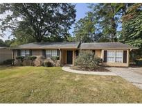 Brick ranch home with well-manicured lawn at 255 Bellwood Ln, Riverdale, GA 30274